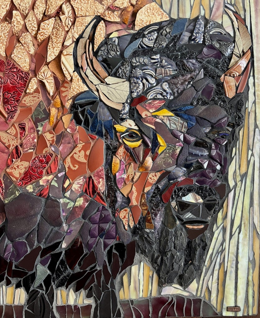 Multicolored mosaic of a bison's head and torso. 