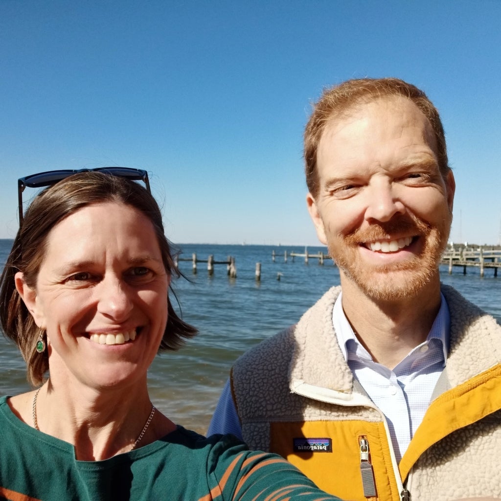 Jody Gunn and Joel Dunn pose for a selfie in front of the Chesapeake Bay.